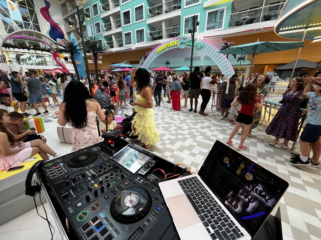 Families dancing at a silent disco with headphones